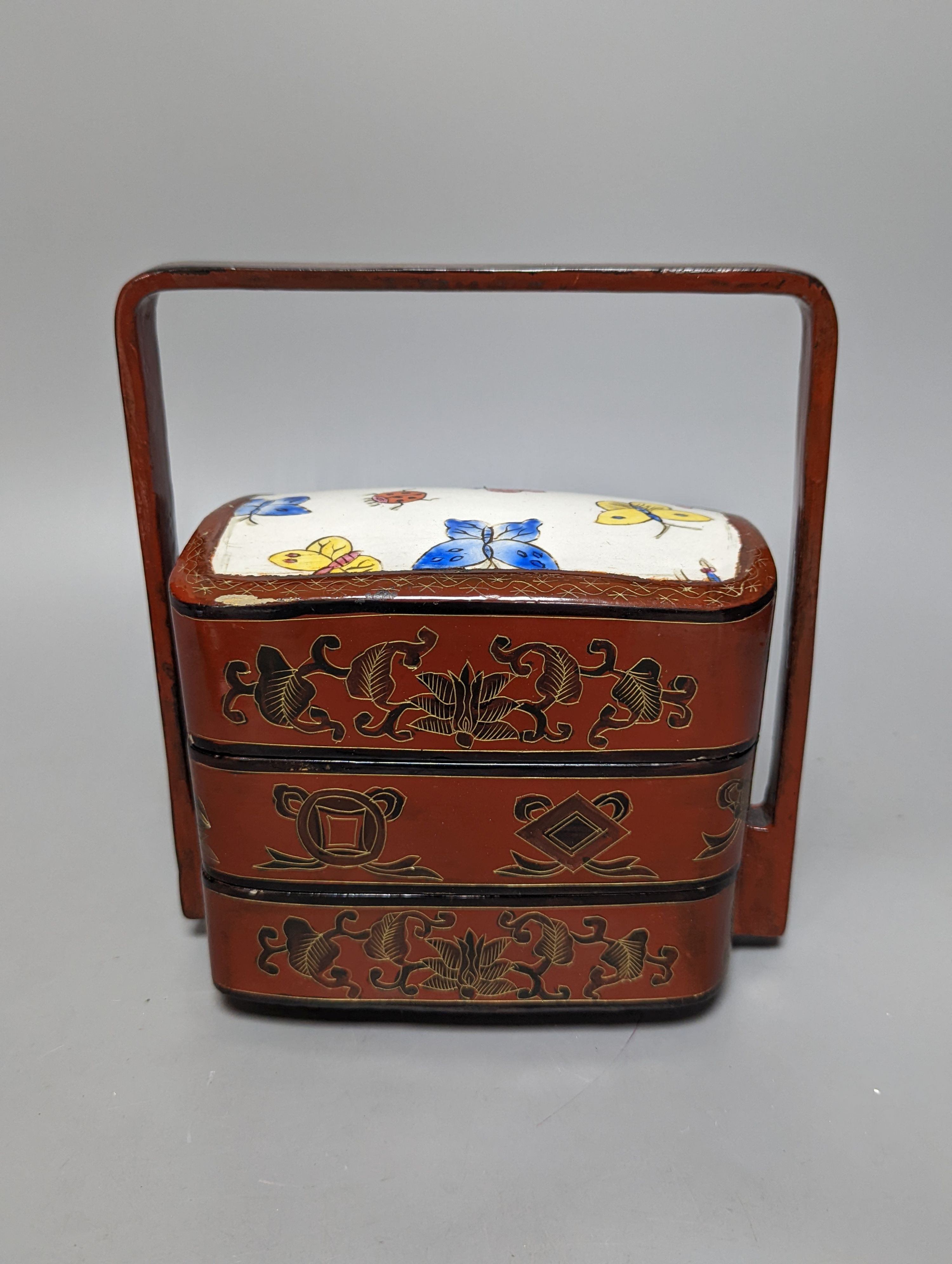 An Oriental lacquer 3 tier picnic box and similar dish, 26cm